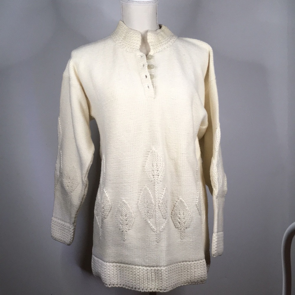 Pullover Sweater mock turtleneck with 4 button closure at neck.